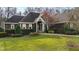 Charming home featuring a large green lawn and stone walkway leading to a welcoming entrance at 1004 Colworth Way, Raleigh, NC 27614