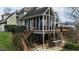 Stunning home with a large deck, a screened-in porch, and a stone patio at 1004 Colworth Way, Raleigh, NC 27614