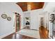 Elegant foyer with hardwood floors, a striking chandelier, and an ornate wood door at 1004 Colworth Way, Raleigh, NC 27614
