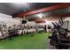 State-of-the-art home gym equipped with various machines, free weights, and mirrored walls at 1004 Colworth Way, Raleigh, NC 27614