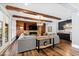 Well-lit living room with exposed beams and seamlessly blending into the kitchen at 1004 Colworth Way, Raleigh, NC 27614
