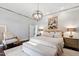 Spacious main bedroom featuring hardwood floors, soft-colored walls, and a luxurious king-size bed at 1004 Colworth Way, Raleigh, NC 27614