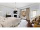 Inviting main bedroom with access to a private balcony overlooking the outdoor living area at 1004 Colworth Way, Raleigh, NC 27614