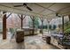 An outdoor kitchen featuring a stainless steel grill and a stone bar top at 1004 Colworth Way, Raleigh, NC 27614