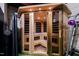 Modern sauna with glass door, wooden interior, and built-in lighting at 1004 Colworth Way, Raleigh, NC 27614