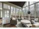 Inviting screened porch with comfortable seating and wooded views, perfect for relaxation and entertaining at 1004 Colworth Way, Raleigh, NC 27614