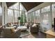 Inviting screened porch with comfortable seating and wooded views, perfect for relaxation and entertaining at 1004 Colworth Way, Raleigh, NC 27614