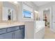 Bathroom features a soaking tub, double vanity, and walk-in closet at 1129 Sequoia Creek Ln, Cary, NC 27519