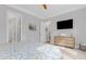 Bedroom showcasing a dresser with a TV and access to another room at 1129 Sequoia Creek Ln, Cary, NC 27519