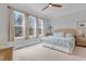Bright bedroom with large windows, a ceiling fan, and comfortable decor at 1129 Sequoia Creek Ln, Cary, NC 27519