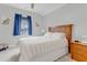 Comfortable bedroom with a queen-sized bed and natural light from the window at 1129 Sequoia Creek Ln, Cary, NC 27519