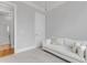 Bedroom featuring a comfortable sofa with view to the adjacent bathroom at 1129 Sequoia Creek Ln, Cary, NC 27519