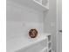 Custom white built-ins provide ample storage with decorative shelving in this home at 1129 Sequoia Creek Ln, Cary, NC 27519