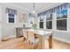 Dining area with natural light, neutral colors, and wood flooring at 1129 Sequoia Creek Ln, Cary, NC 27519