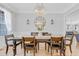 Traditional dining room with wood table, decorative lighting, and charming decor at 1129 Sequoia Creek Ln, Cary, NC 27519