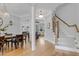 Bright foyer with hardwood floors leads to dining, living spaces, and an elegant staircase at 1129 Sequoia Creek Ln, Cary, NC 27519