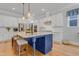 Spacious kitchen boasting a central island, stainless steel appliances, and ample counter space at 1129 Sequoia Creek Ln, Cary, NC 27519
