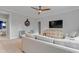 Comfortable living room with neutral tones, plush seating and a media cabinet at 1129 Sequoia Creek Ln, Cary, NC 27519