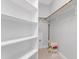 Spacious walk-in closet with custom shelving and ample storage space at 1129 Sequoia Creek Ln, Cary, NC 27519