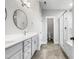 Sleek bathroom with double vanity, large mirror, and a glass-enclosed shower at 120 Breyla Way, Holly Springs, NC 27540