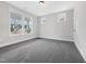 Bright bedroom with large windows offering plenty of natural light and gray carpet at 120 Breyla Way, Holly Springs, NC 27540
