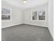 Bright bedroom with large windows offering plenty of natural light and gray carpet at 120 Breyla Way, Holly Springs, NC 27540