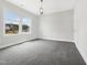 Bright, unfurnished bedroom featuring large windows and neutral carpeting at 120 Breyla Way, Holly Springs, NC 27540
