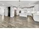 Open concept kitchen featuring white cabinets, stainless steel appliances, and large island at 120 Breyla Way, Holly Springs, NC 27540