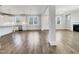 Spacious open-concept living room featuring hardwood floors, natural light, and view to the kitchen at 120 Breyla Way, Holly Springs, NC 27540