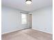 Simple bedroom with light blue walls, a neutral carpet, and a window providing natural light at 120 Galax Ln, Durham, NC 27703