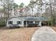 Charming single-story home with a covered carport, a well-manicured lawn, and mature trees at 120 Galax Ln, Durham, NC 27703