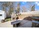 Outdoor living space with a stone fireplace and built-in grilling area at 136 Pelham St, Haw River, NC 27258