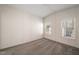 Sun-filled bedroom features neutral carpet, ceiling fan, and two windows at 136 Pelham St, Haw River, NC 27258