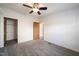 Bedroom featuring closet, bathroom access, and wood-look laminate flooring at 136 Pelham St, Haw River, NC 27258