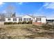 Charming single-story home with white siding, dark shutters, and a well-maintained front yard at 136 Pelham St, Haw River, NC 27258