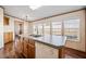 Functional kitchen island featuring ample counter space, a double sink, and wood cabinets at 136 Pelham St, Haw River, NC 27258