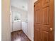 Bright laundry room with an exterior door and a washer and dryer at 136 Pelham St, Haw River, NC 27258