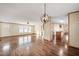 Open-concept layout showcasing the kitchen with modern appliances and fixtures, and wood flooring at 136 Pelham St, Haw River, NC 27258
