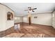 Spacious living room featuring wood floors and an open layout with connection to the kitchen at 136 Pelham St, Haw River, NC 27258