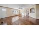 Bright living room with wood flooring and lots of windows offering natural light at 136 Pelham St, Haw River, NC 27258