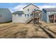 Home exterior featuring a screened porch with a staircase and large backyard at 143 Rossell Park Cir, Garner, NC 27529