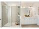 Modern bathroom featuring a glass-enclosed shower and double vanity sinks at 143 Rossell Park Cir, Garner, NC 27529