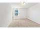 Empty bedroom with carpet flooring, one window, and white walls at 143 Rossell Park Cir, Garner, NC 27529