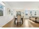 Dining room with sleek wooden table and chairs with large window views at 143 Rossell Park Cir, Garner, NC 27529
