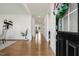 Inviting foyer with hardwood floors and view to the open living space with its neutral walls, enhancing the home's bright feel at 143 Rossell Park Cir, Garner, NC 27529