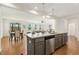 Modern kitchen featuring granite countertops, stainless steel appliances, and an open floor plan at 143 Rossell Park Cir, Garner, NC 27529