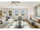 Comfortable living area with natural light, hardwood flooring, and stylish furnishings at 143 Rossell Park Cir, Garner, NC 27529