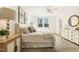 Cozy main bedroom with plush bedding, ample natural light, and elegant décor at 143 Rossell Park Cir, Garner, NC 27529