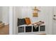 Practical mudroom area with a built-in bench, storage cubbies, and hooks, providing a convenient space for organization at 143 Rossell Park Cir, Garner, NC 27529