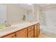 Bright bathroom with double sink vanity, tile flooring, and shower-tub combo at 146 Skyros Loop, Cary, NC 27519